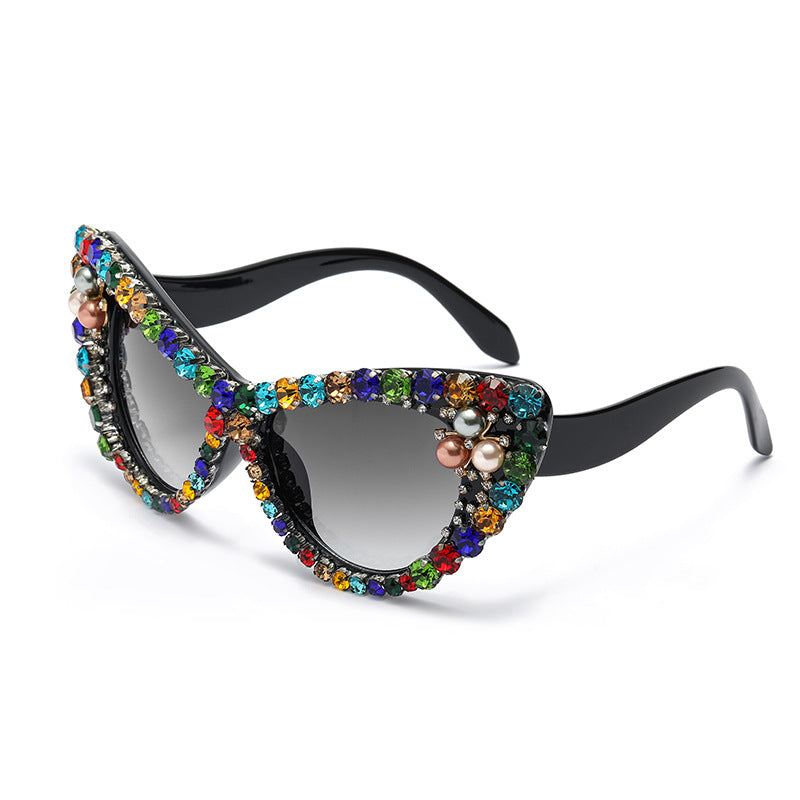 Sunglasses with colorful gemstones on a white background
